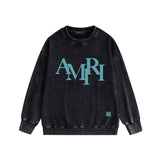 Amiri washed sweatshirt with overlapping letters and foam printing washed and distressed
